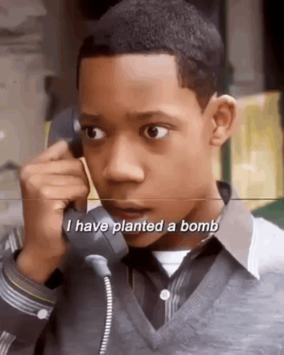 Young Boy Talking on Phone I Have Planted a Bomb