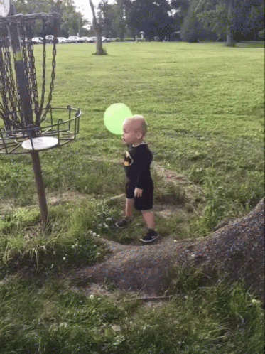 Young Boy Trying Frisbee GIF