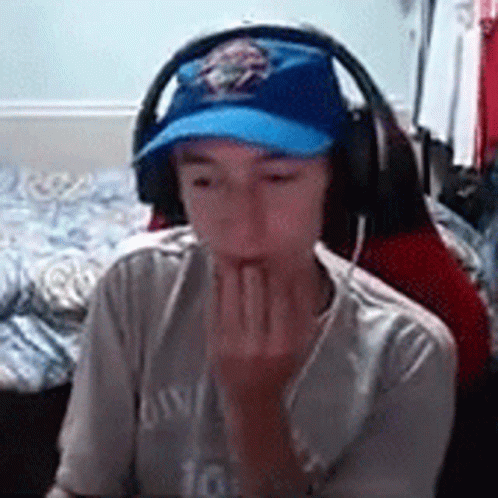 Young Boy Wearing Headphones and Blue Hat