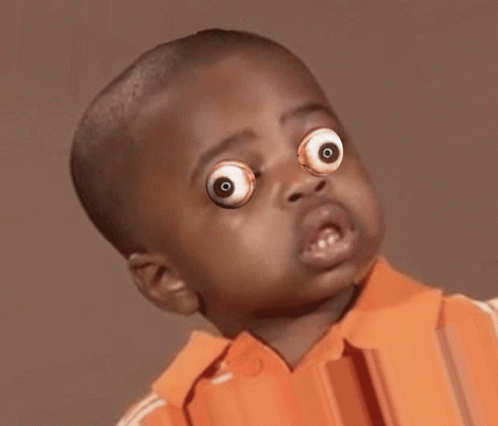 Young Boy With Googly Eyes and Orange Shirt