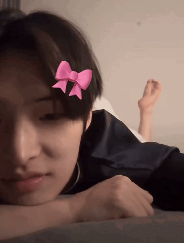 Young Boy With Pink Bow