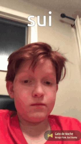 Young Boy with Red Hair Looking at Camera Sui