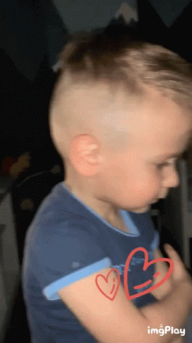 Young Boy With Two Red Hearts GIF
