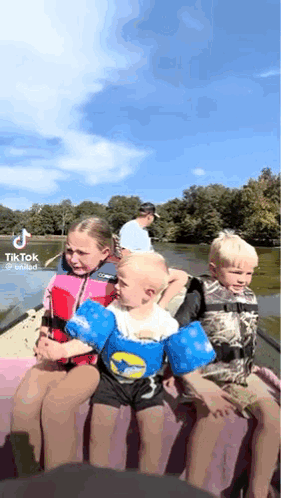 Young Children In Boat On Lake GIF