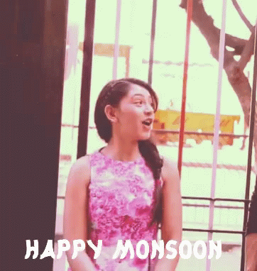 Young Couple Enjoying Monsoon Weather GIF