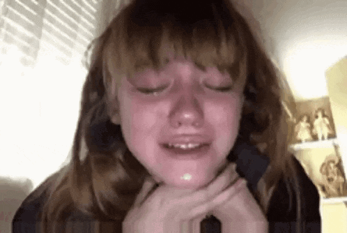 Young Girl Crying with Eyes Closed