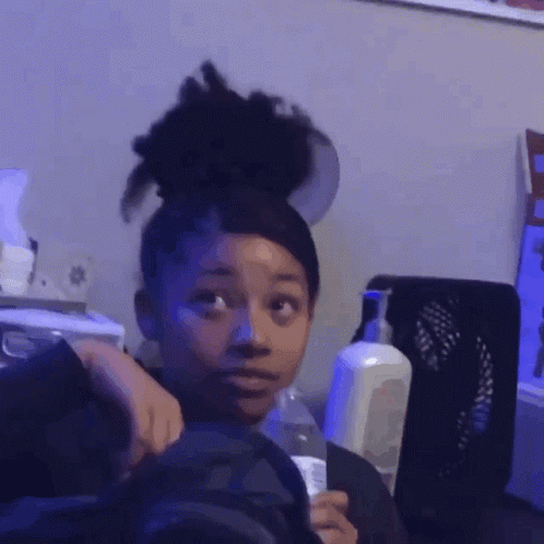 Young Girl Holding Bottle of Water
