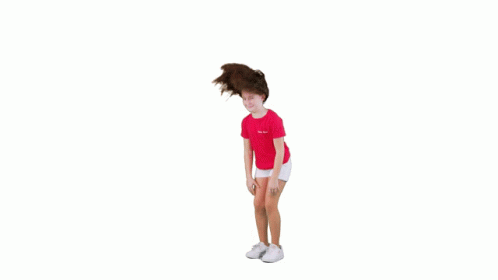 Young Girl in Pink Shirt and White Shorts Jumping