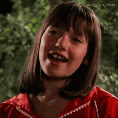 Young Girl In Red Jacket Making Funny Face GIF
