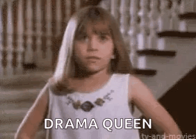 Young Girl in White Dress Says Drama Queen by Stairs