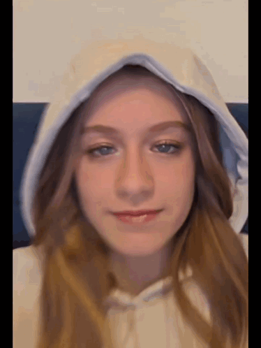 Young Girl in White Hoodie With Hood Up