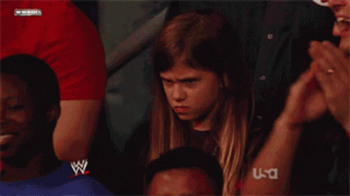Young Girl in Wrestling Ring With W Logo Shirt