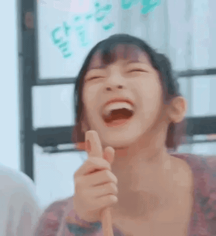 Young Girl Laughing and Pointing
