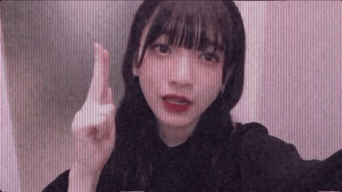 Young Girl Making Funny Face and Pointing Finger