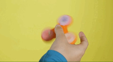 Young Girl Playing Fidget Spinner GIF