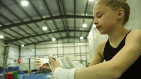 Young Girl Putting Chalk On Her Hand GIF