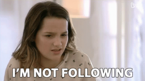 Young Girl Sitting at Table Saying I'm Not Following