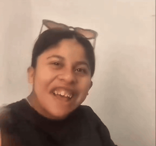 Young Girl Smiling In Sunglasses And Black Shirt GIF