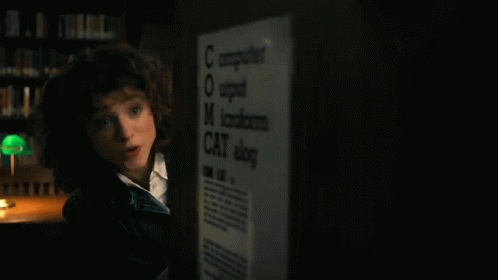 Young Girl Standing In Front Of Computer GIF