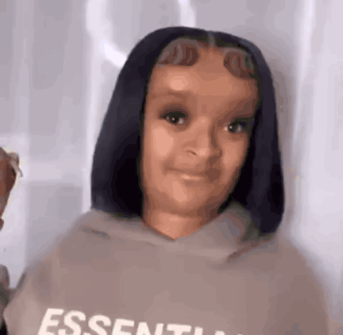 Young Girl Wearing Essentials Hoodie