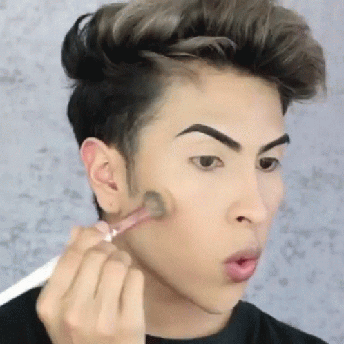 Young Man Applying Makeup