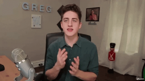 Young Man at Microphone with Greg on Wall