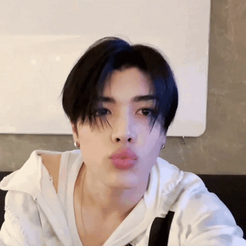 Young Man Blowing Kiss GIF