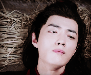 Young Man Close Up With Straw Background