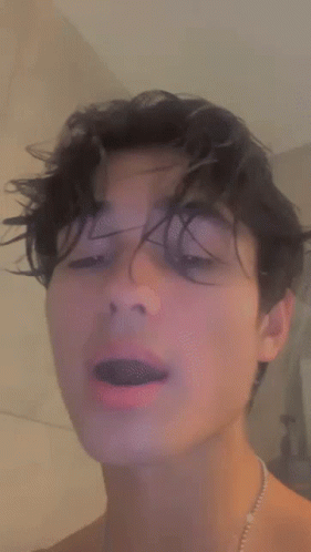 Young Man Closing Eyes And Opening Mouth GIF