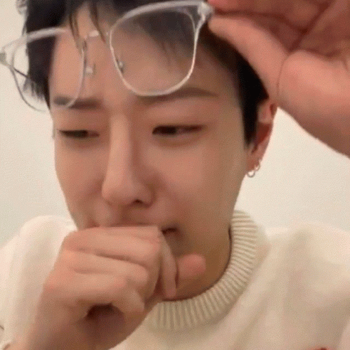Young Man Covering Mouth With Hand GIF