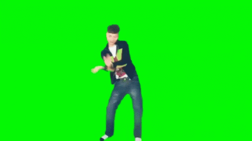 Young Man Dancing in Front of Green Screen