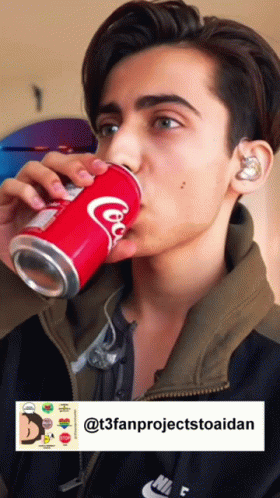 Young Man Drinking Coca Cola
