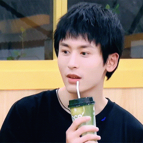 Young Man Drinking Through Straw GIF