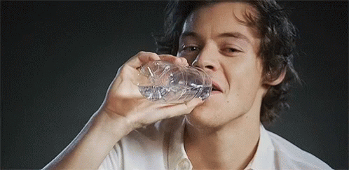 Young Man Drinking Water