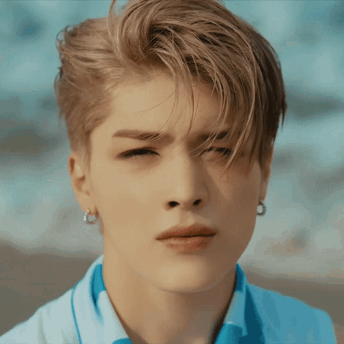 Young Man Eyes Closed Hair Blowing in Wind