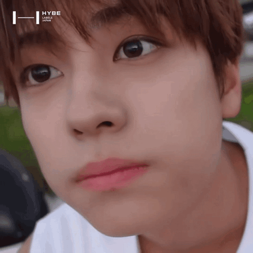 Young Man Face With Hybe Logo on Forehead