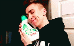 Young Man Holding Ariel Detergent GIF
