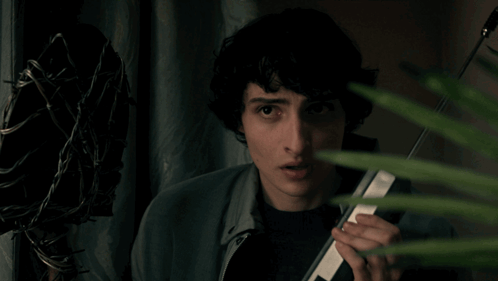 Young Man Holding Cell Phone