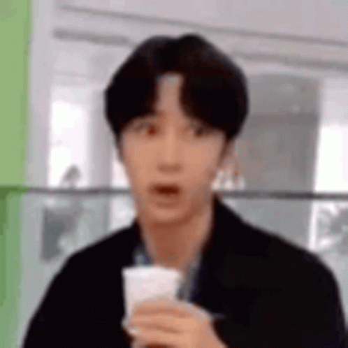 Young Man Holding Coffee Surprised GIF