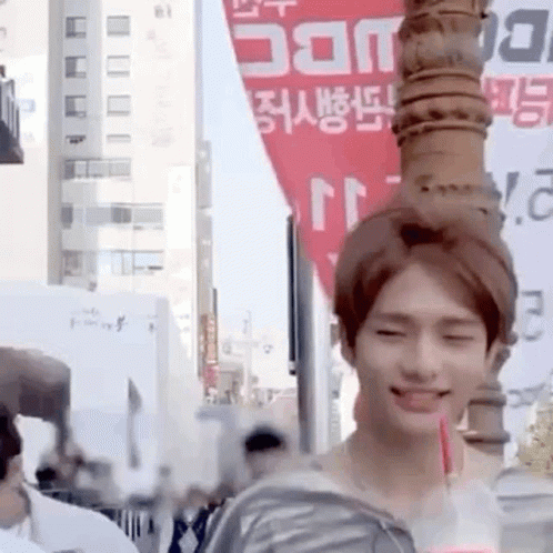 Young Man Holding Drink Smiling