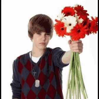 Young Man Holding Red And White Flowers GIF