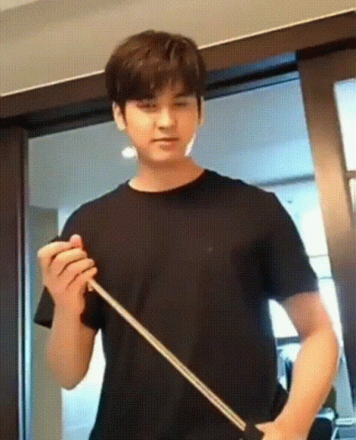 Young Man Holding Stick At Sliding Door GIF