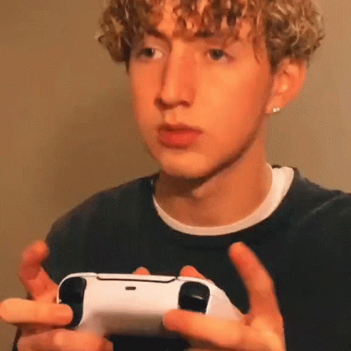 Young Man Holding Video Game Controller