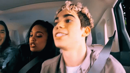 Young Man in Back Seat With Two Women