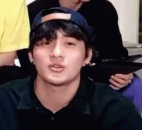 Young Man in Baseball Cap Making Funny Face