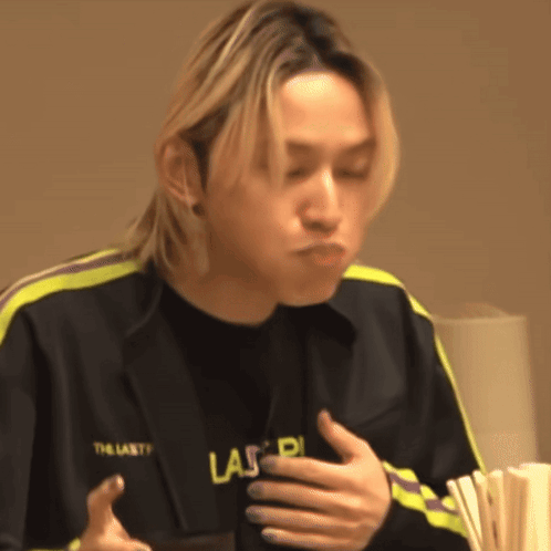 Young Man in Black Jacket Saying Las