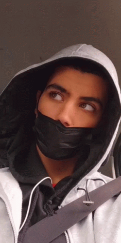 Young Man in Black Mask and Hoodie