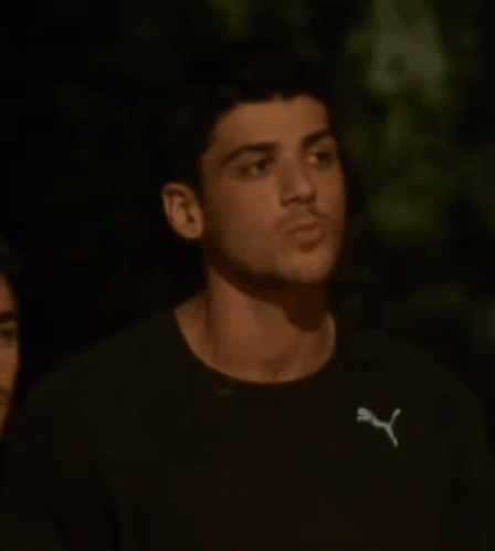 Young Man in Black Puma T-Shirt