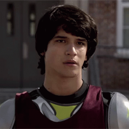 Young Man in Black Shirt and Red Vest