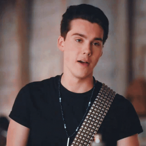 Young Man in Black Shirt and Silver Studded Belt